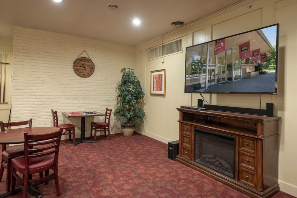 Game and fireplace area at Park Place Senior Living in Sacramento, California