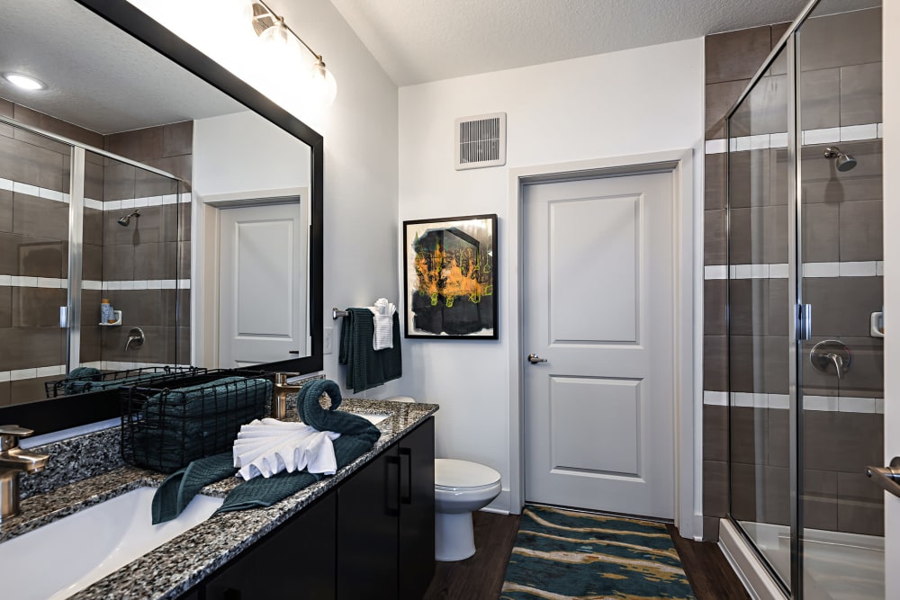 Bathroom with glass shower at Olympus Preserve at Town Center in Jacksonville, Florida