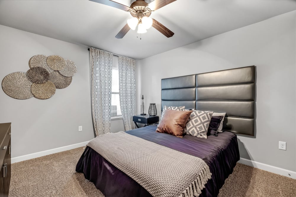 Fully-furnished model bedroom at Palisades at Pleasant Crossing in Rogers, Arkansas