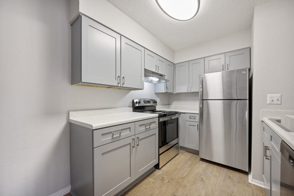 Apartment kitchen with stainless steel appliances at The Beacon in Huntsville, Alabama