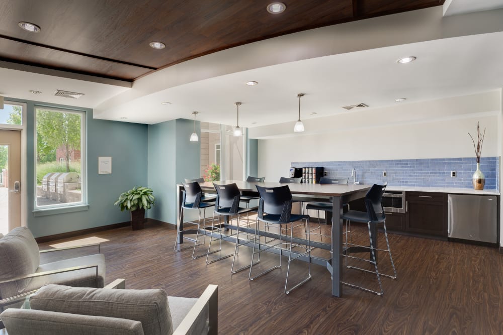Community clubhouse with a kitchen island at Arcadia at Rivers Edge in Medford, Massachusetts
