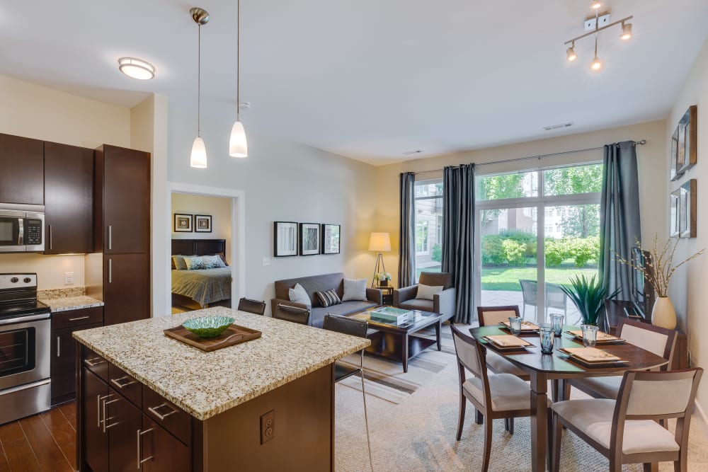 Model living space with large windows at Arcadia at Rivers Edge in Medford, Massachusetts