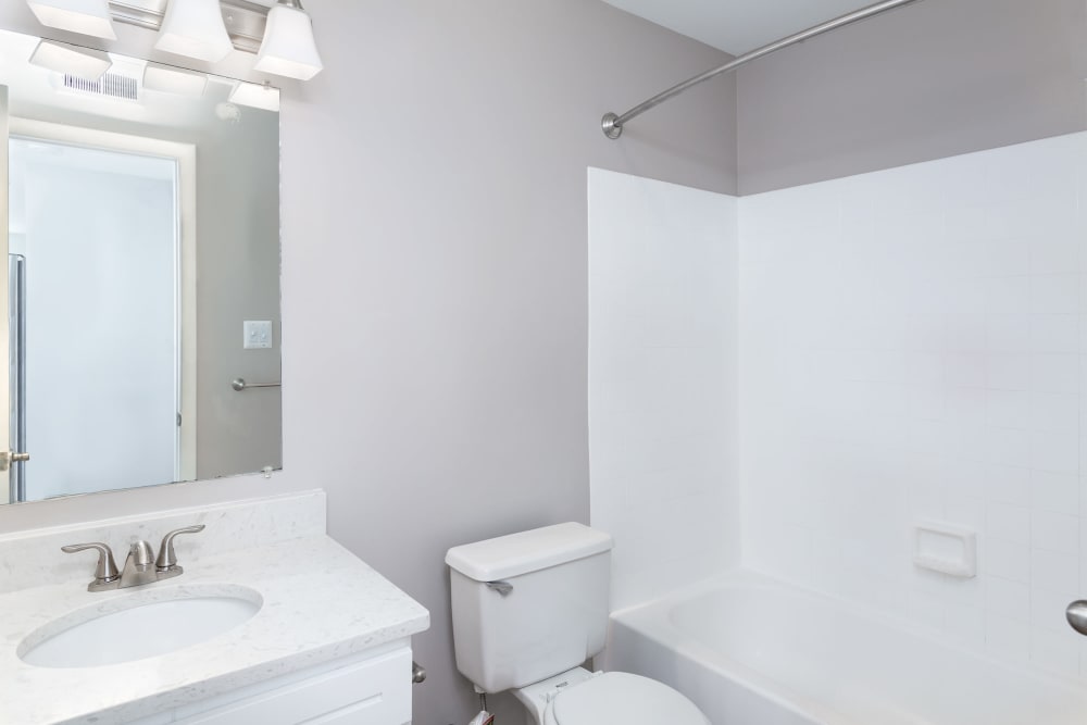 An apartment bathroom with a bathtub at Springwoods at Lake Ridge in Woodbridge, Virginia