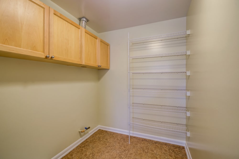 Laundry room with shelves in Bellevue in Washington, District of Columbia. Items in home may vary. 
