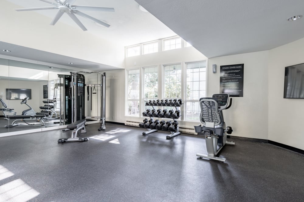 Community gym with various workout equipment at The Knoll Redmond in Redmond, Washington