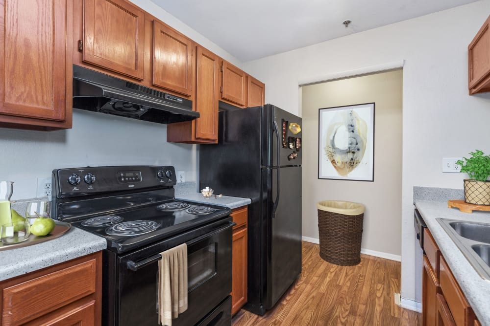 Kitchen with modern appliances at Austell Village Apartment Homes in Austell, Georgia