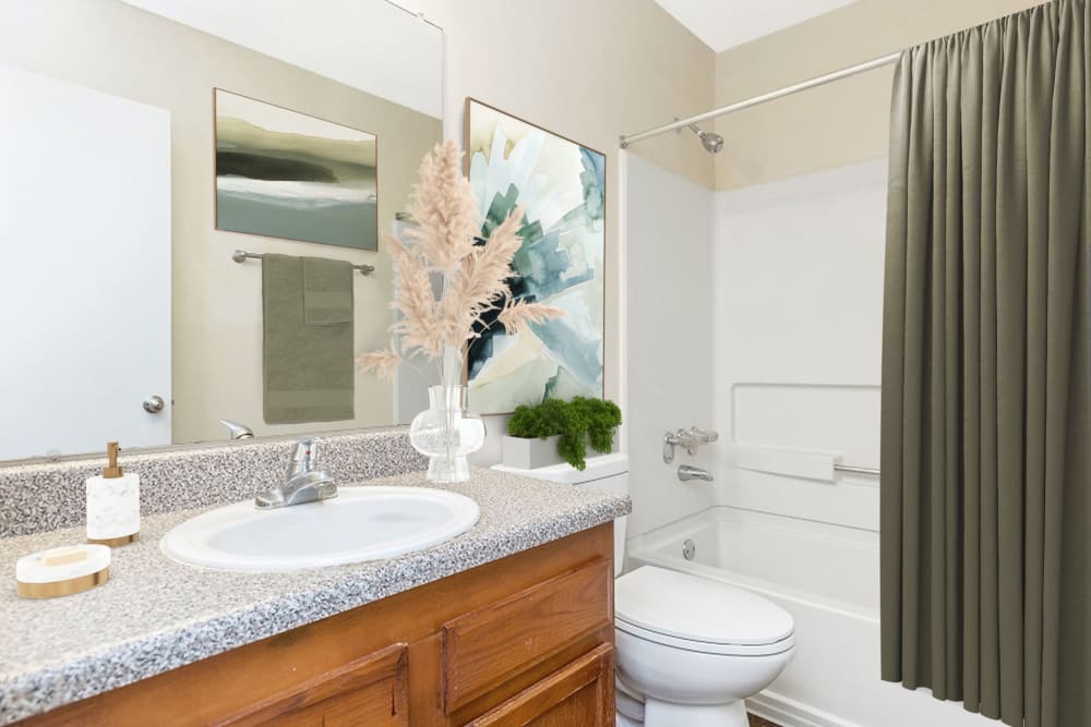 Bathroom with solid countertops at Austell Village Apartment Homes in Austell, Georgia