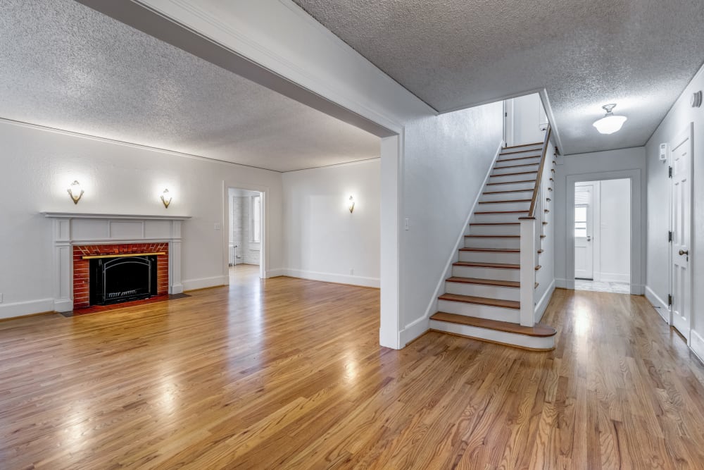Open concept with stairs and fireplace at Broadmoor in Joint Base Lewis McChord, Washington