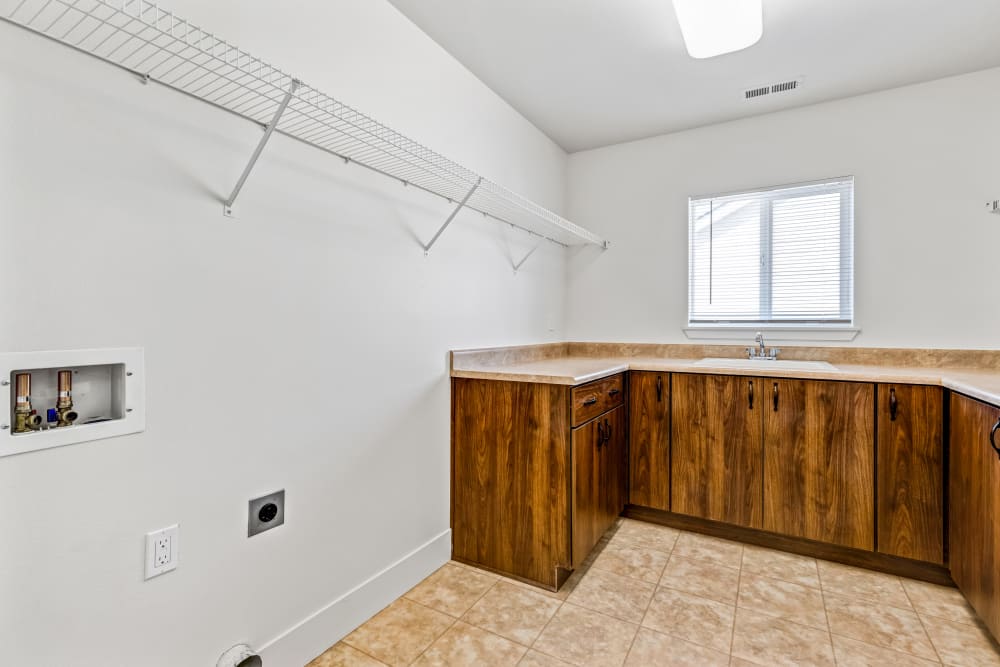 Large laundry room with storage at Cascade Village in Joint Base Lewis McChord, Washington