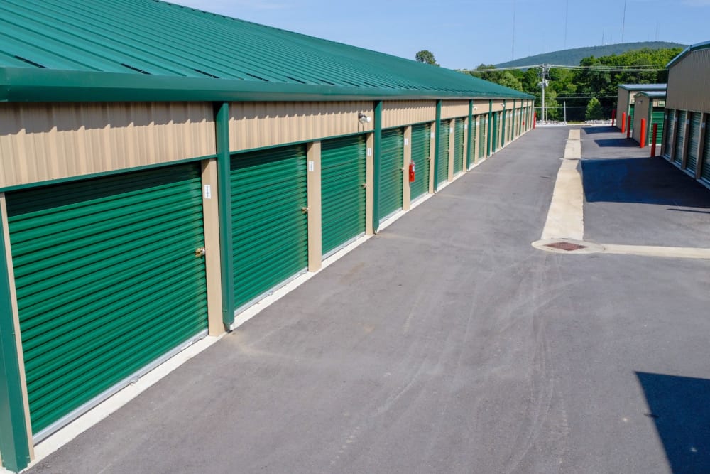 Outside the units with green rollup at Highway 10 Storage in Little Rock, Arkansas
