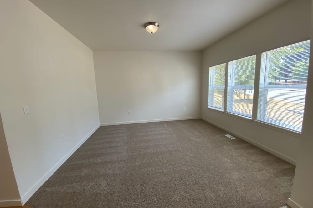 Living Room with wall of windows at Cascade Village in Joint Base Lewis McChord, Washington