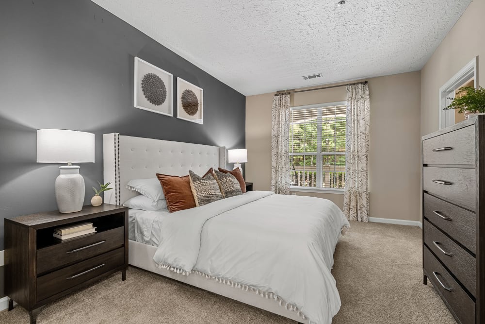 large bedroom with carpet and natural light at Marquis at Sugarloaf in Duluth, Georgia