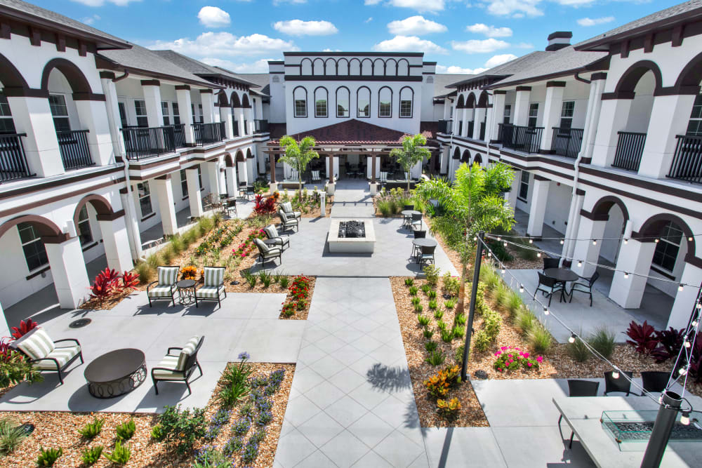 Example assisted living courtyard at sunset for The Blake at St. Johns in St. Johns, Florida