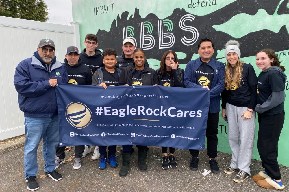 Employees with Eagle Rock Care Banner at Plainview, New York