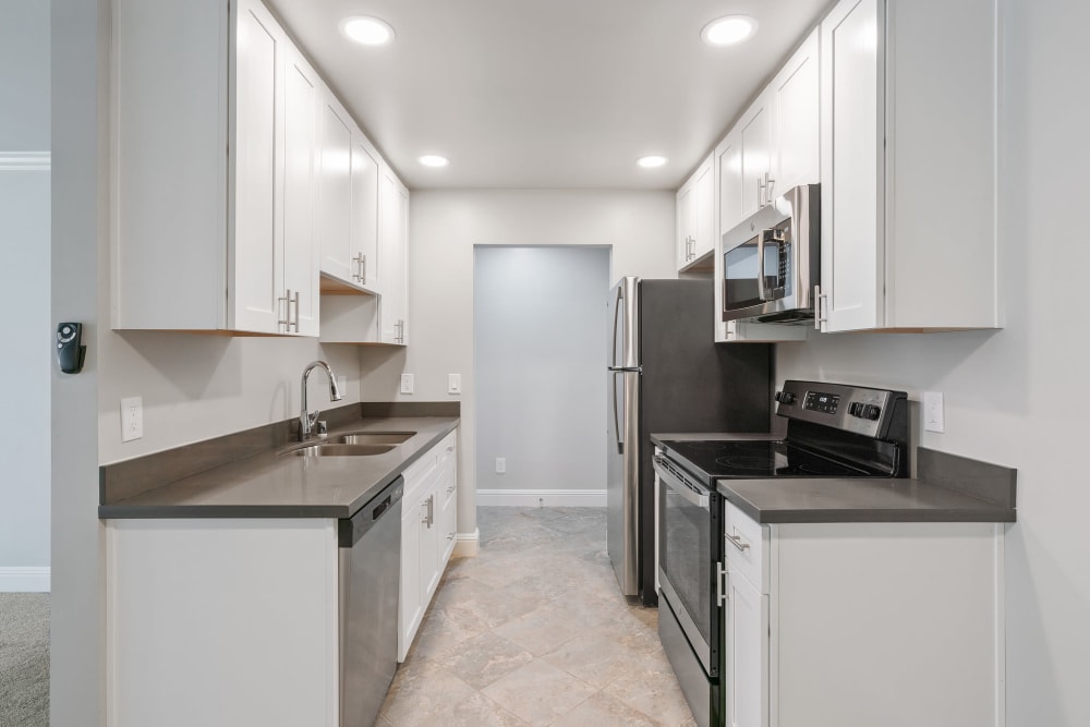 Kitchen with white cabinets at Regency Plaza Apartments