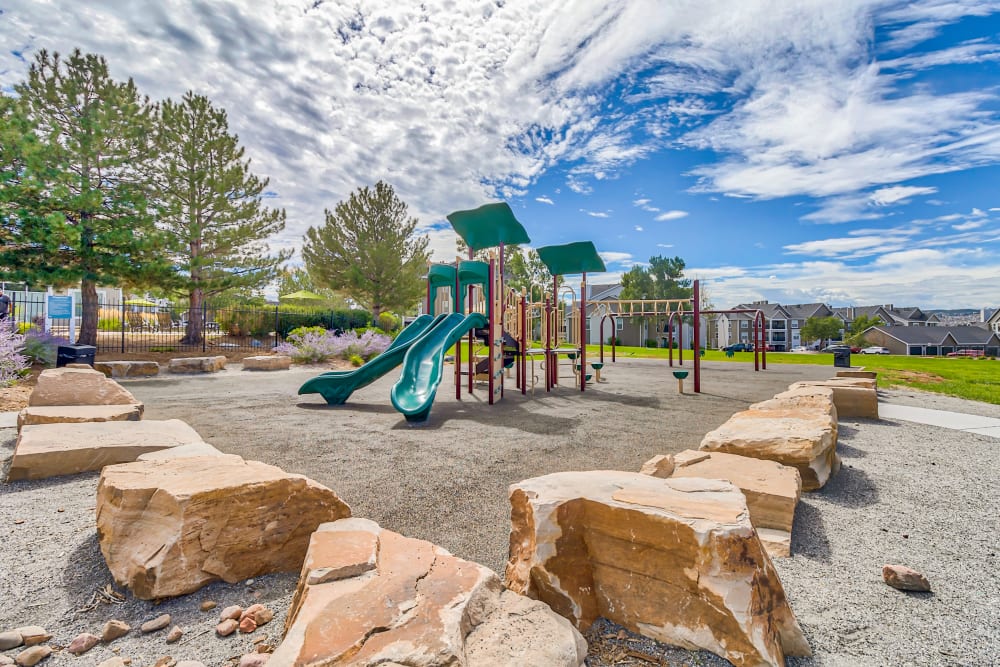 Community playground and bolder jump area at The Pines at Castle Rock Apartments in Castle Rock, Colorado
