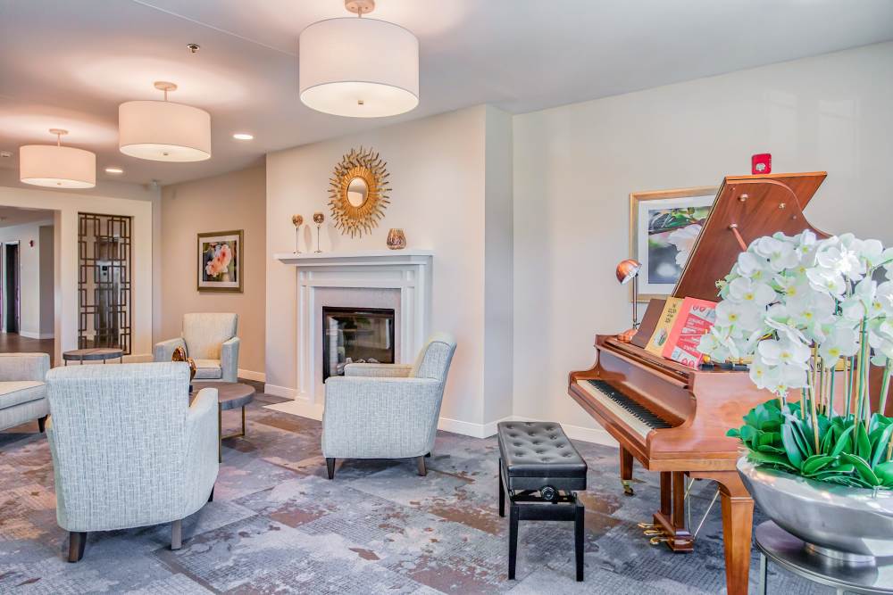 Lobby area with piano Revela at O'Fallon in O'Fallon, Illinois