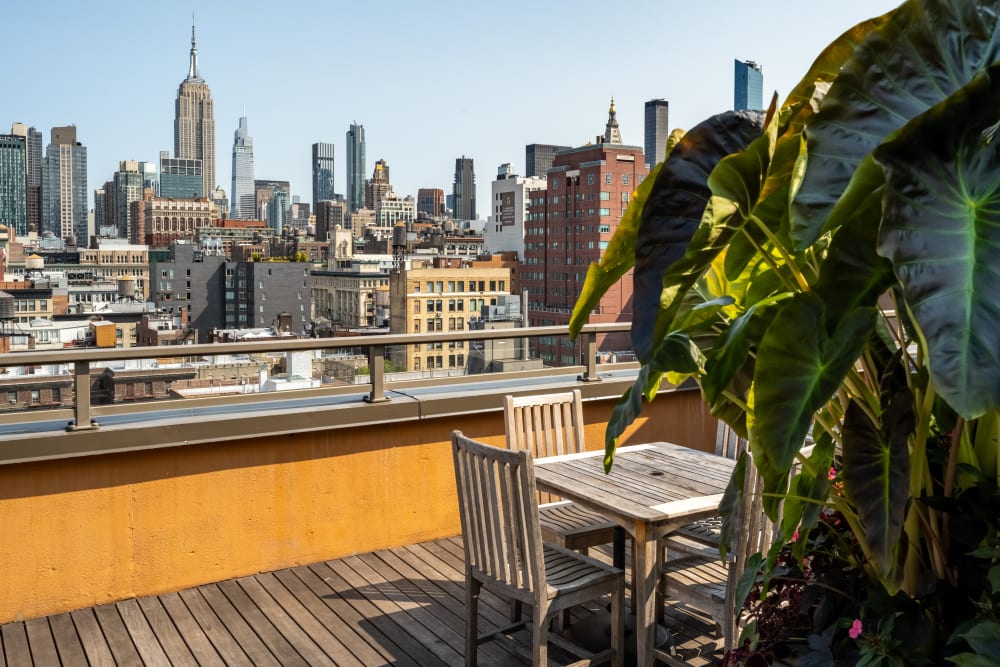 Rooftop table with views of the city at The Sierra Chelsea in New York, New York