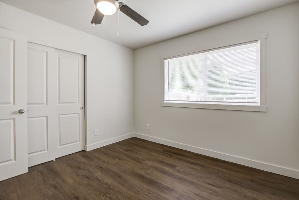 Bedroom with ceiling fan and closet at Heartwood in Joint Base Lewis McChord, Washington
