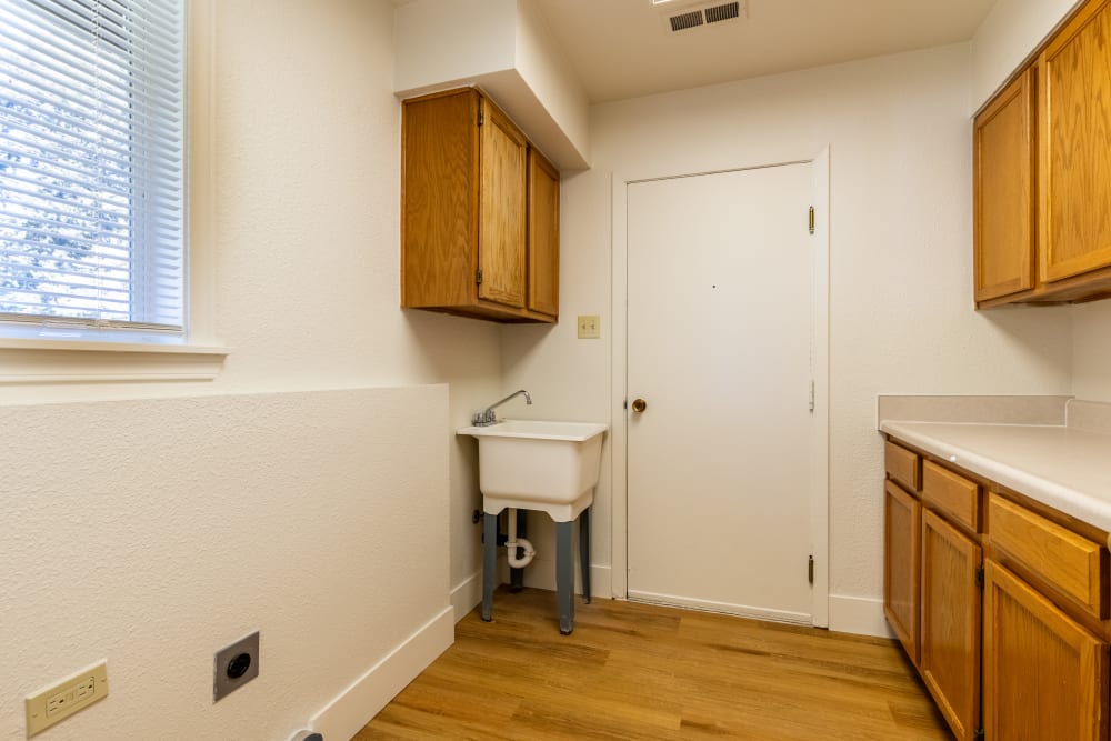 Laundry room with storage at New Hillside in Joint Base Lewis McChord, Washington