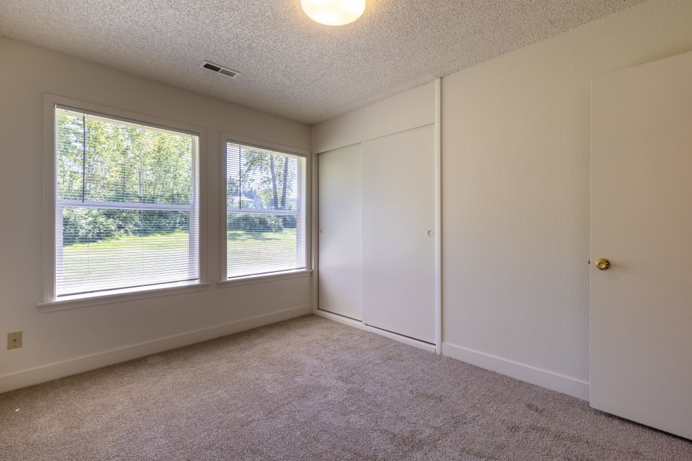 Bedroom with oversized windows and closet at New Hillside in Joint Base Lewis McChord, Washington