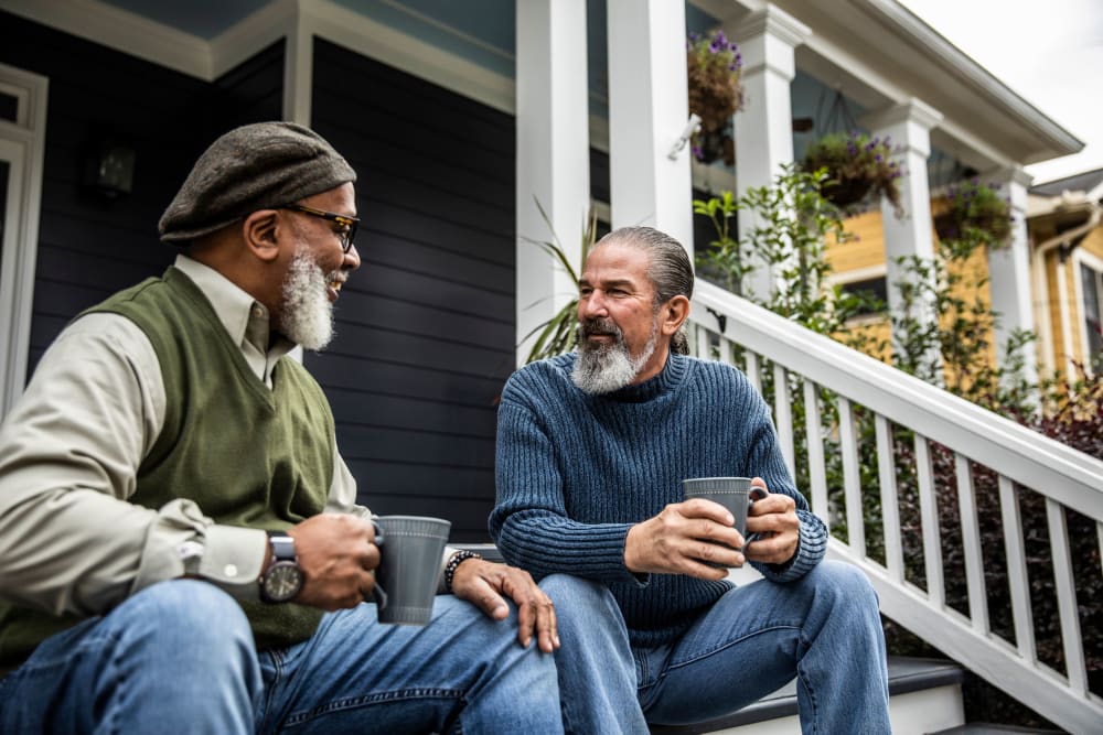 Residents chatting on the porch at Indigo Ridge in New Bern, North Carolina