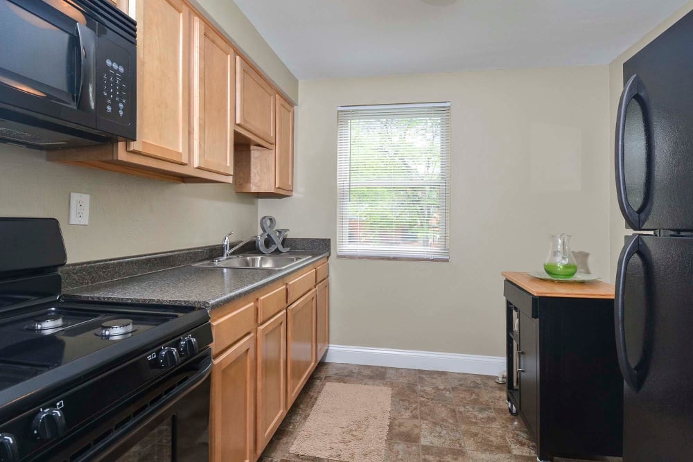 Model kitchen with wood cabinets at The Alden, Pittsburgh, Pennsylvania