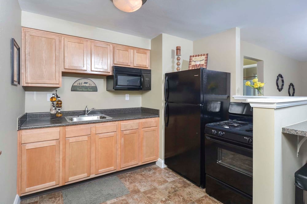 Model kitchen with wood cabinets at The Alden, Pittsburgh, Pennsylvania