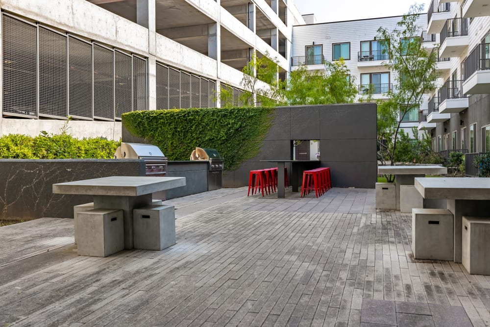 Modern-style outdoor patio area with chairs and table at Marq on Burnet in Austin, Texas