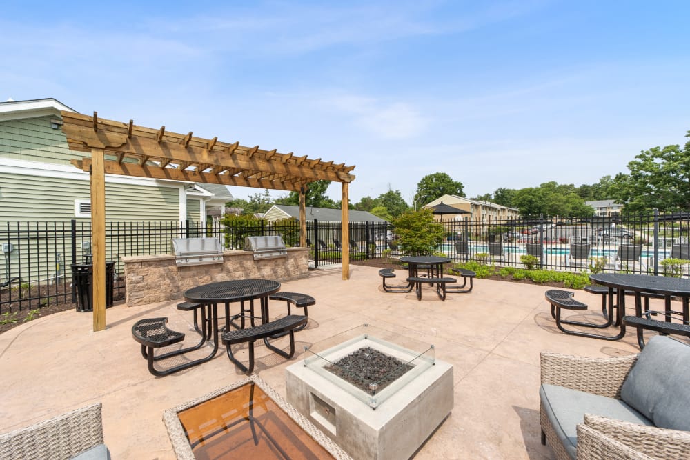 Outdoor grilling & dining area at Satyr Hill Apartments in Parkville, Maryland