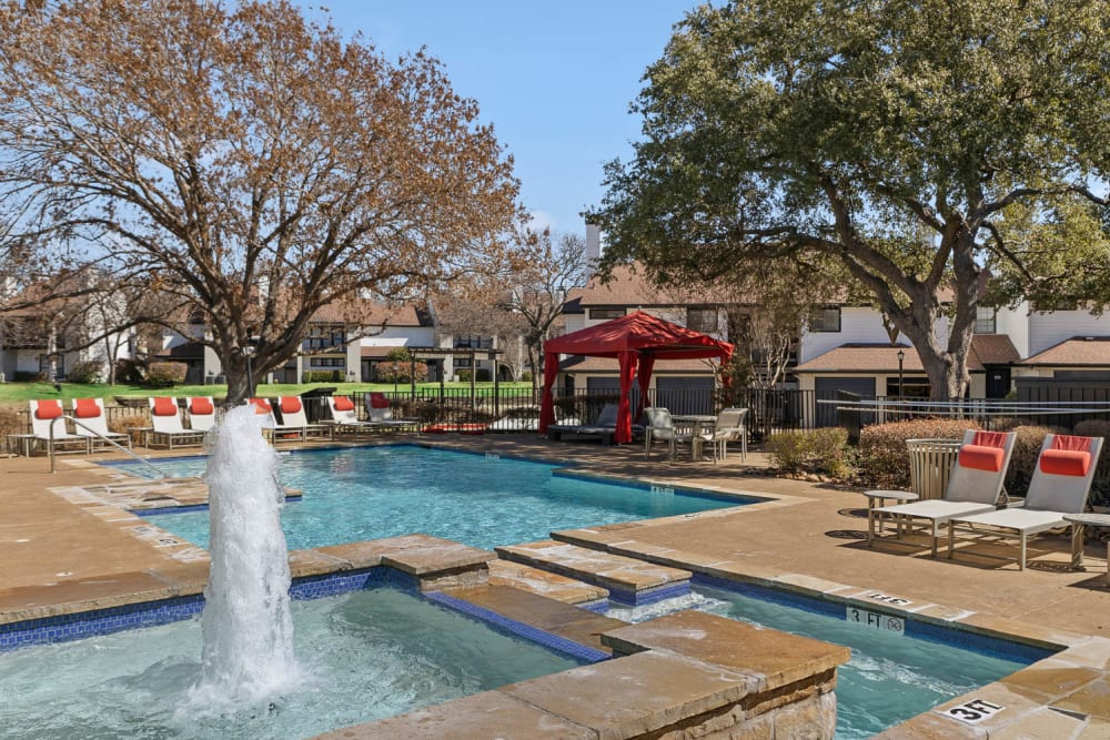 Resort style saltwater pool sundeck cabana at Embry Apartments in Carrollton, Texas