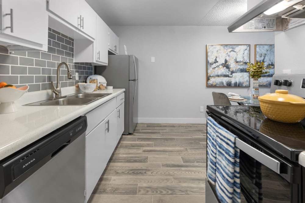 Model kitchen with hardwood floors at Las Brisas Apartments in Tucson, Arizona
