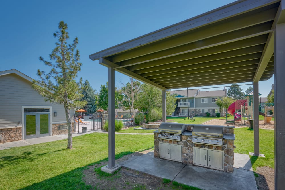 Covered barbecue area at Crossroads at City Center Apartments in Aurora, Colorado