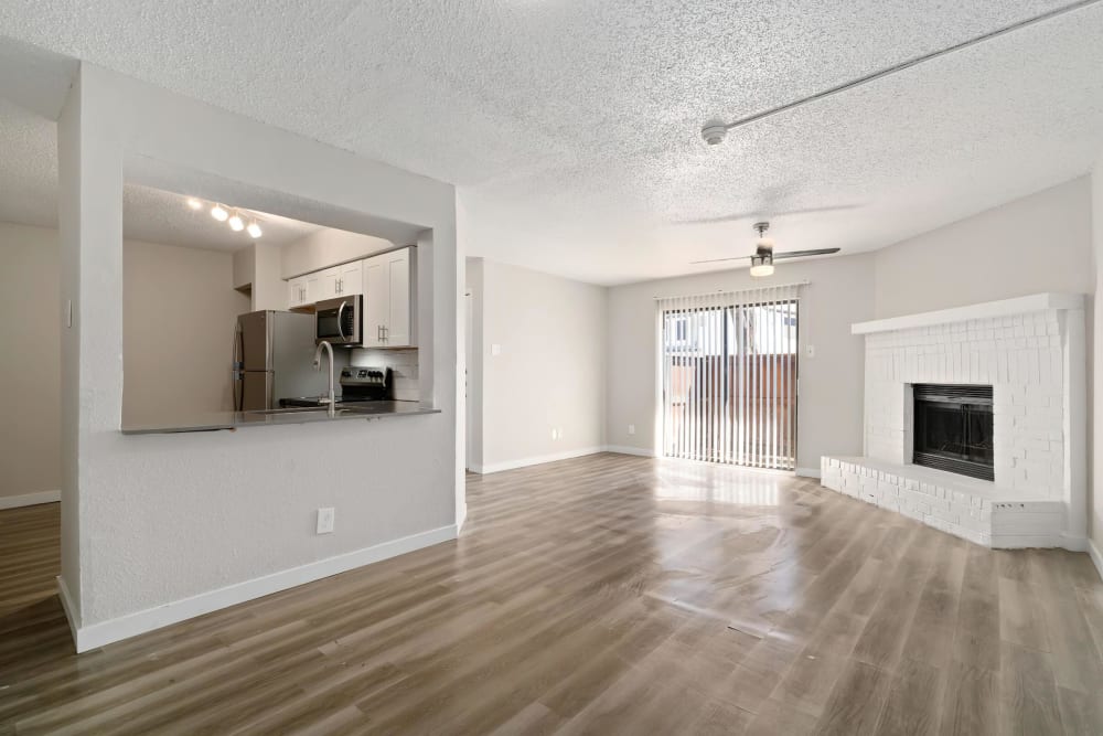 Spacious apartment with wood-style flooring at Tides at Meadowbrook in Fort Worth, Texas