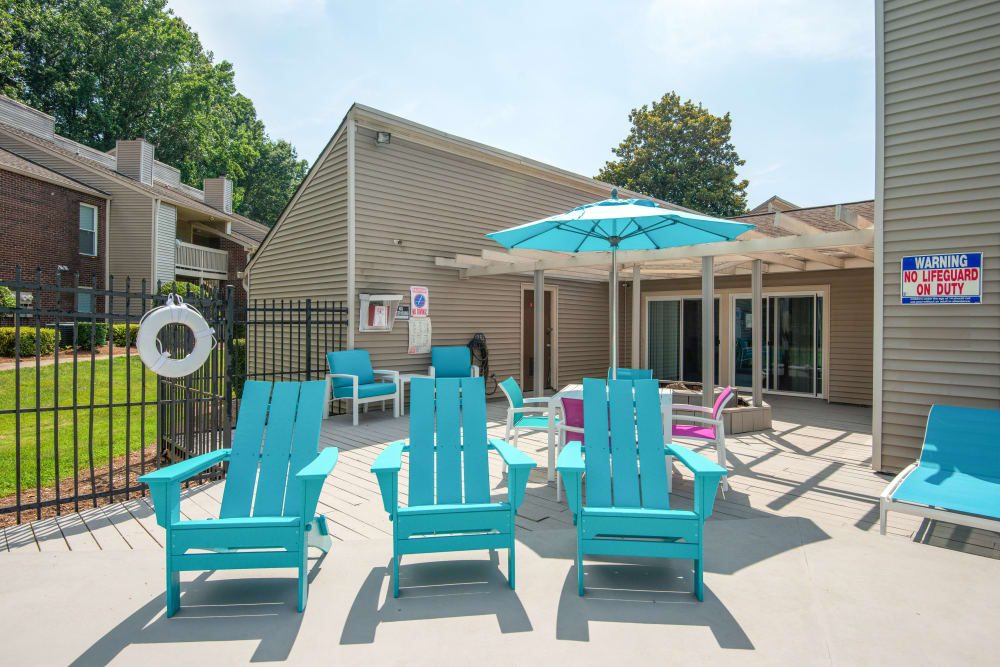 Blue benches and Umbrella at Devonwood Apartment Homes in Charlotte, North Carolina