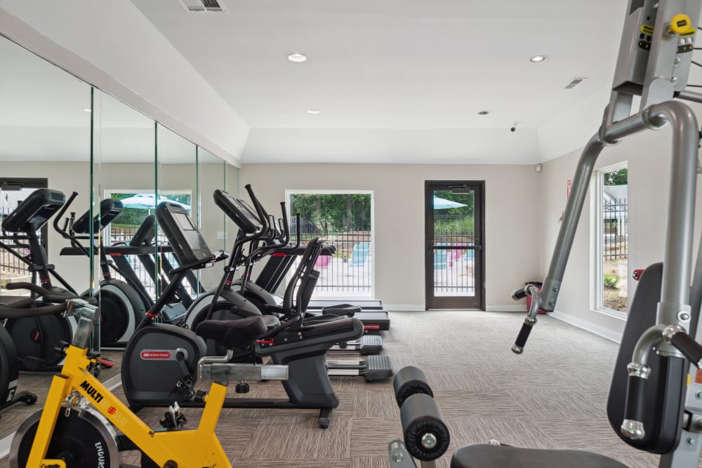 Other side of the Fitness Center at The Oasis at Regal Oaks in Charlotte, North Carolina with the view outside the pool area