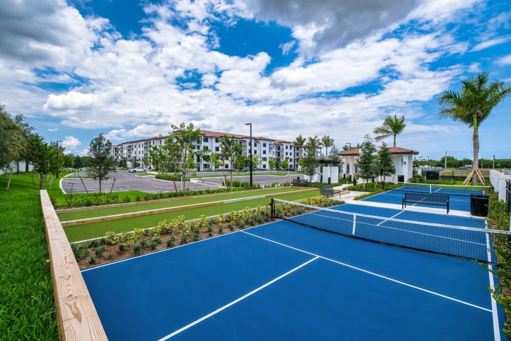 Beautiful turf tennis courts at The Residences at Monterra Commons in Cooper City, Florida