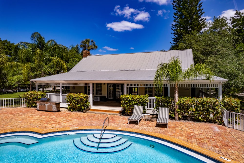 The community pool and exterior of the clubhouse at Mode at Ballast Point in Tampa, Florida