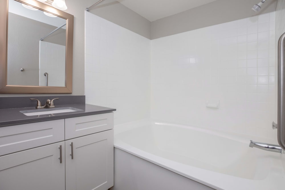 Bathroom with granite countertops at Tides at North Nellis in Las Vegas, Nevada