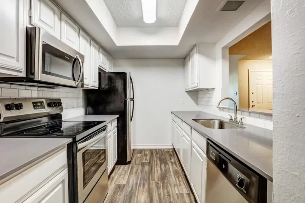 Kitchen at Embry Apartments in Carrollton, Texas