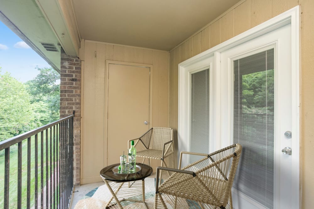 Covered patio with metal railing at Candlewood Apartment Homes in Nashville, Tennessee