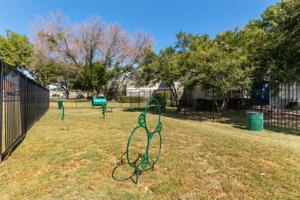 Bark park with interactive obstacle at Valley Oaks in Hurst, Texas