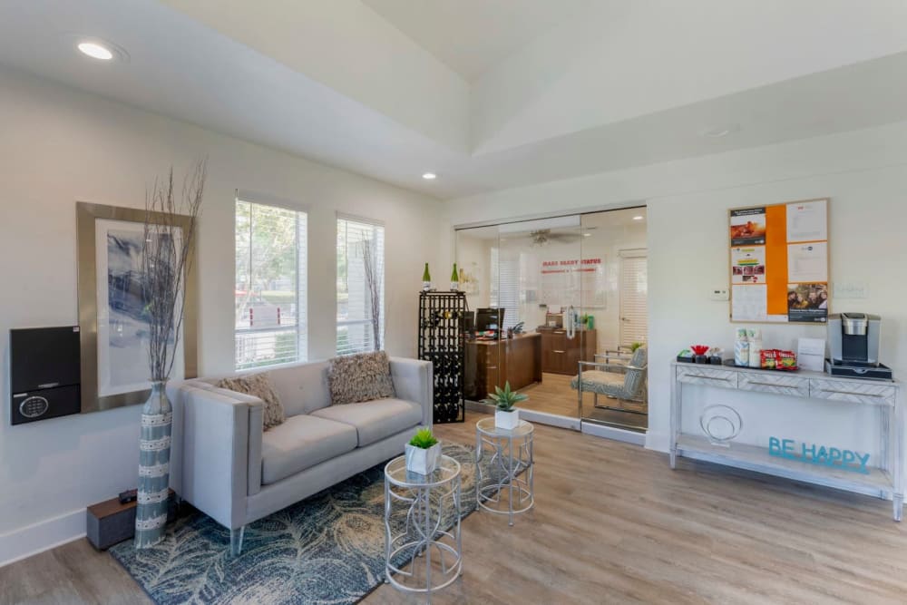 Model living room with hardwood floors at Valley Oaks in Hurst, Texas