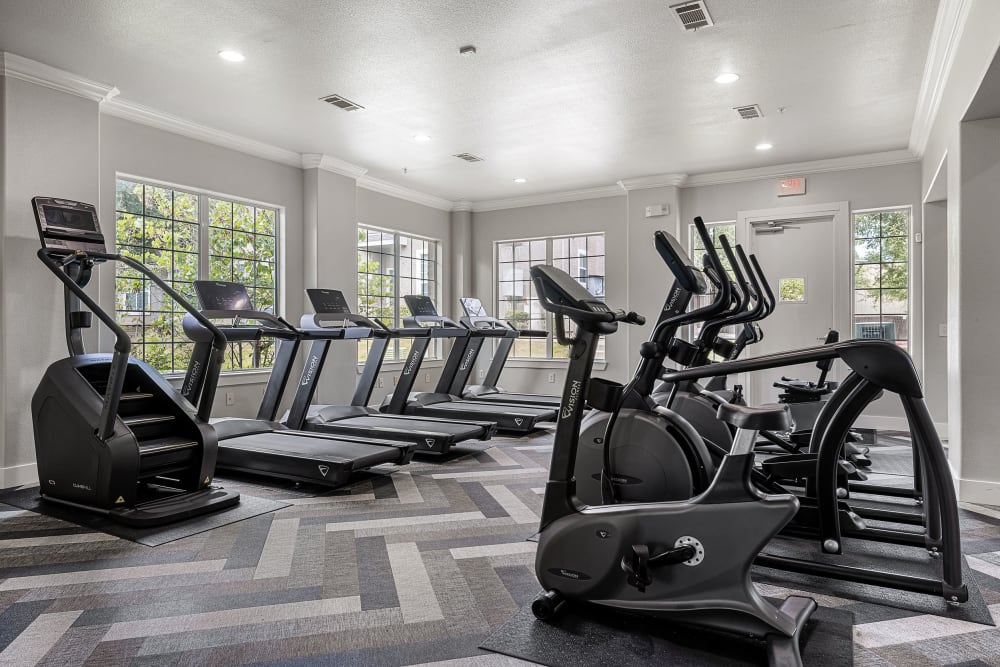 Cardio equipment in the gym at Marquis at The Cascades in Tyler, Texas