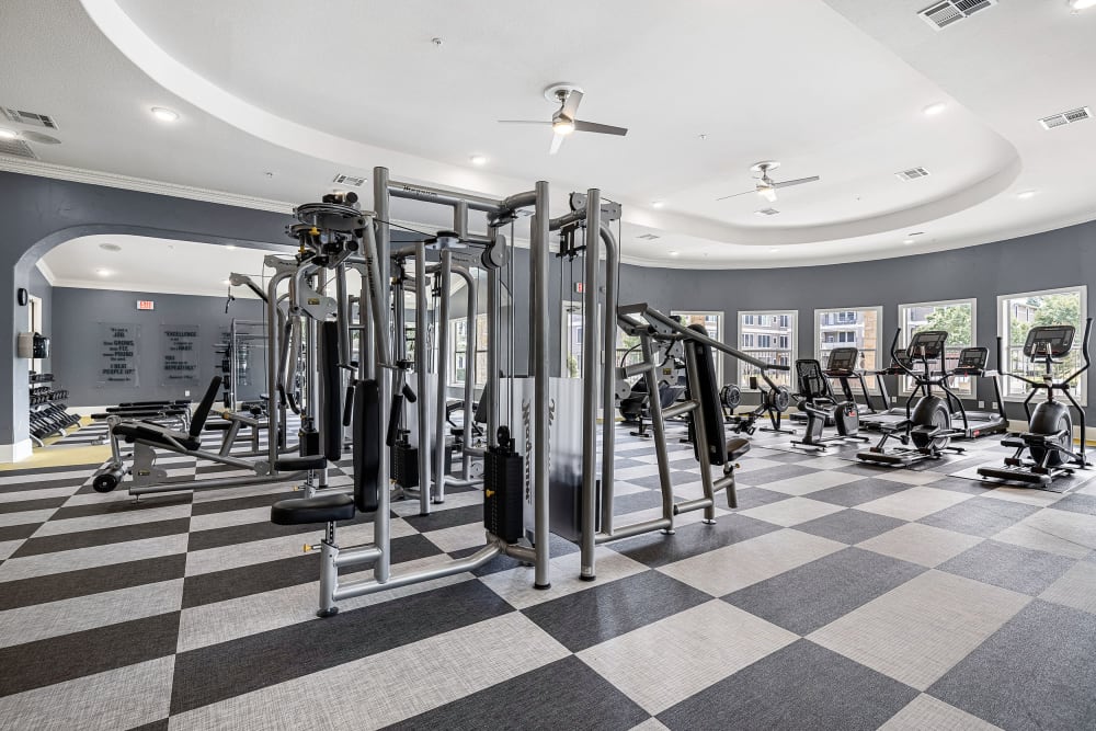 Updated fitness center with cardio and weight machines at Marquis at The Cascades in Tyler, Texas