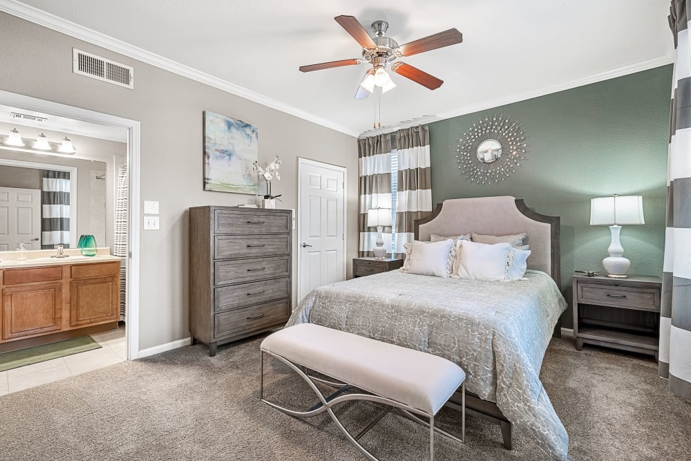 Modern style bedroom with multiple windows at Marquis at The Cascades in Tyler, Texas