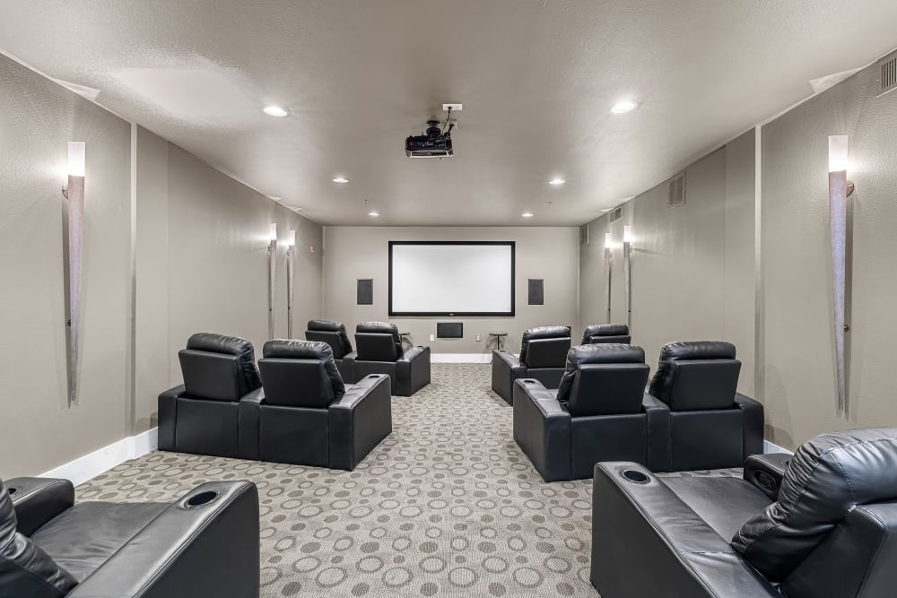 Private community theater with leather seats at Marquis at Texas Street in Dallas, Texas