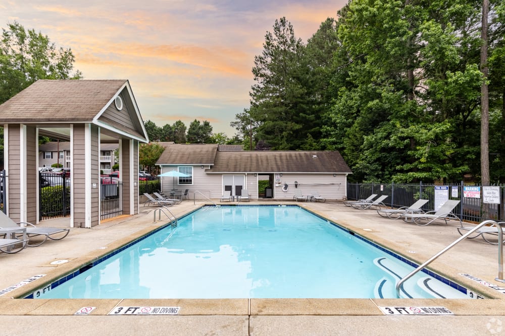 Swimming pool with nice chairs at Gregory Lane Apartments in Acworth, Georgia
