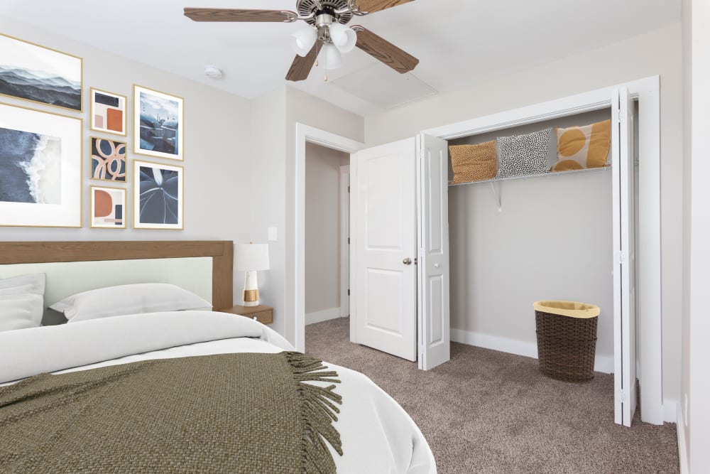 Bedroom with plush carpet at The Hills at Oakwood Apartment Homes in Chattanooga, Tennessee