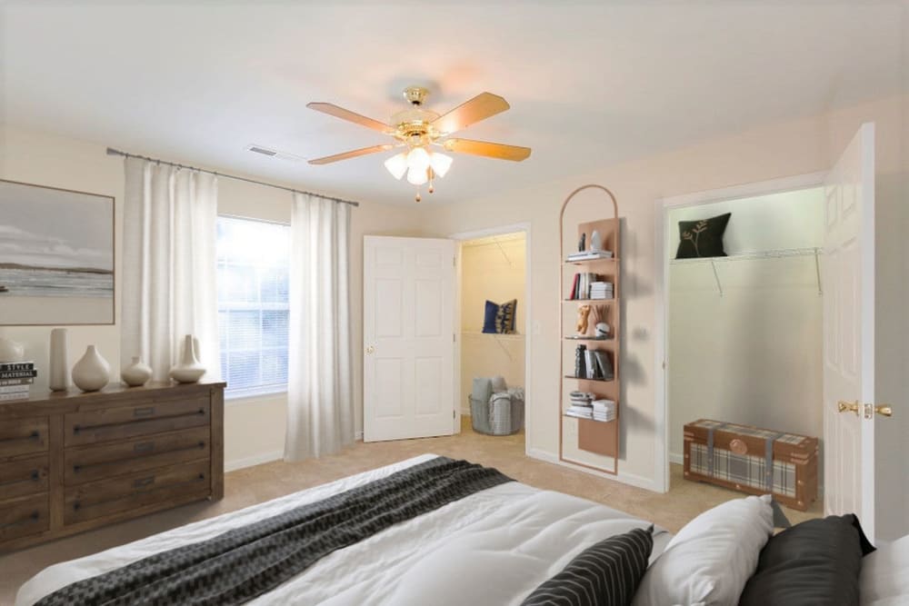 Bedroom with ceiling fans at Home Place Apartments in East Ridge, Tennessee
